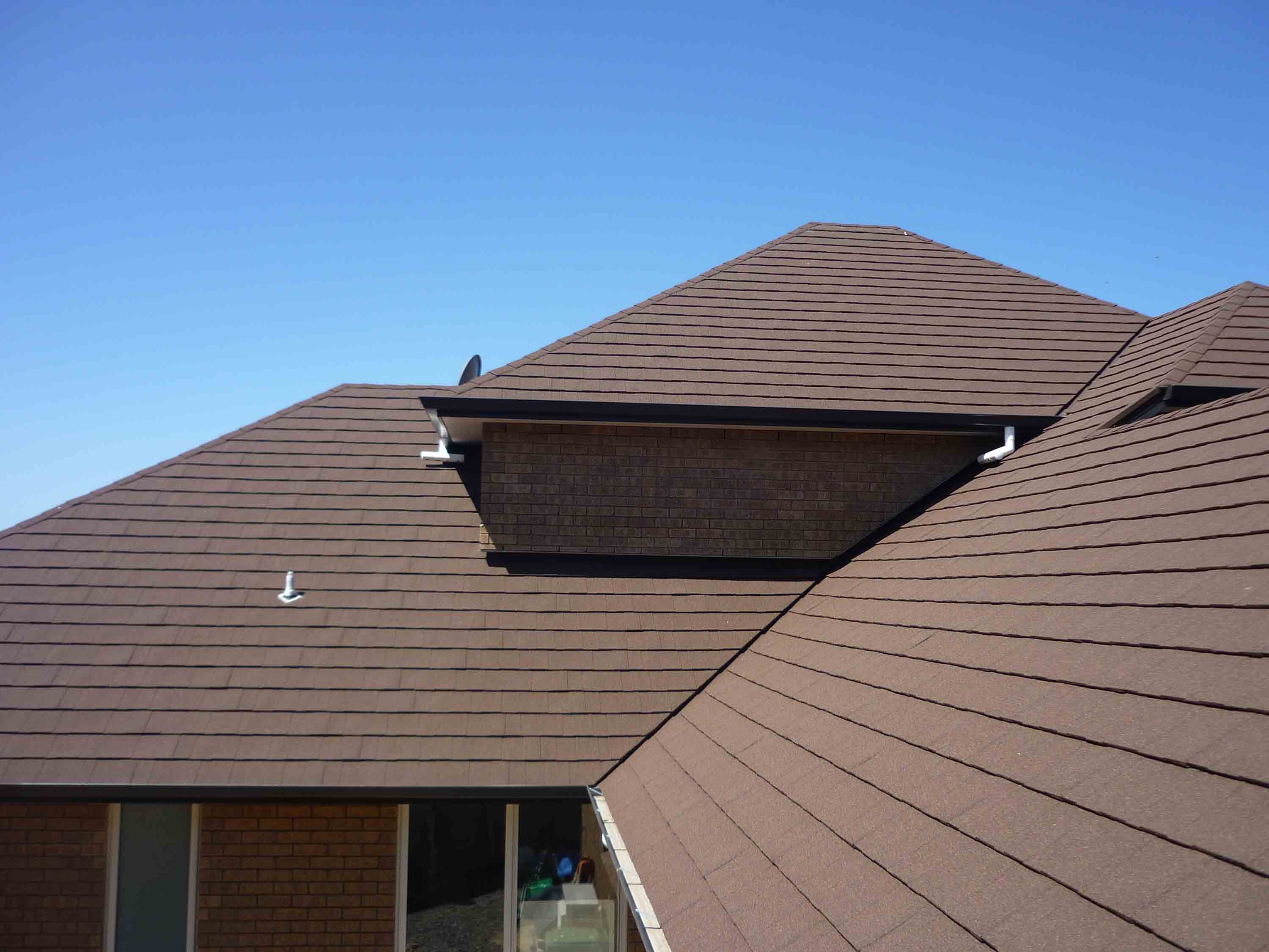 Home roofed in CF Slate metal panels.