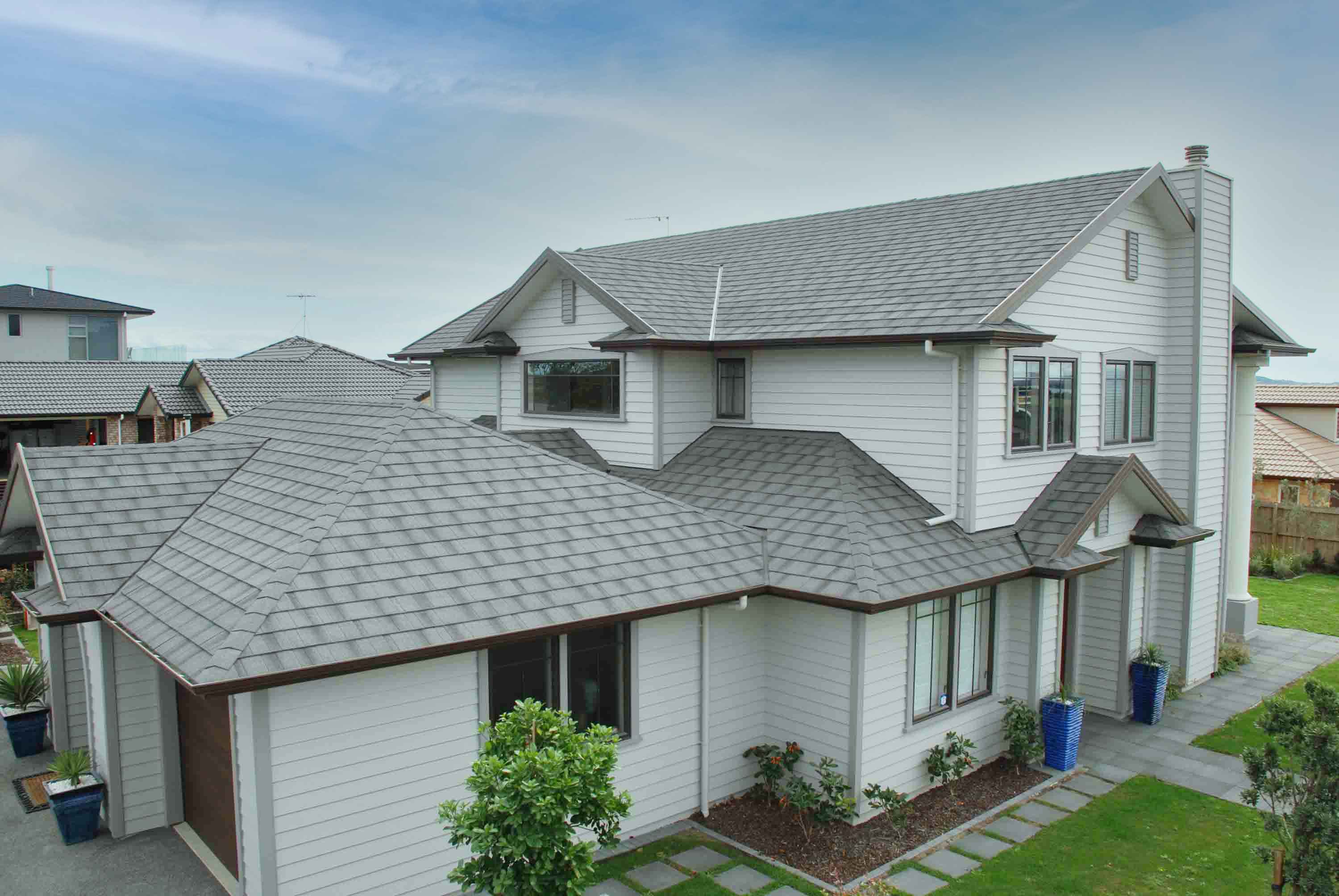 Family home, weatherboard with CF Slate Ashwood metal roof.